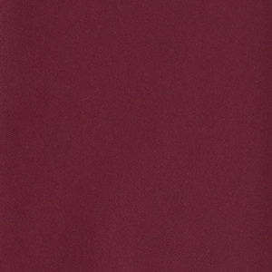 Detailed close-up of dark red wine-colored textile fabric with fine plain weave texture