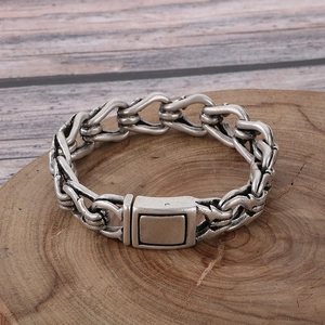 Close-up of vintage silver industrial chain bracelet with a square mechanical clasp