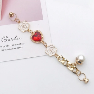 Golden bracelet with red heart gem, white camellia flowers and pearl for phone DIY decor