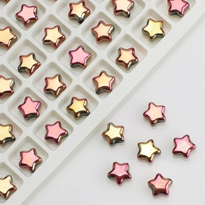 Close-up of 8mm gradient crystal star beads for DIY jewelry making in a white grid tray