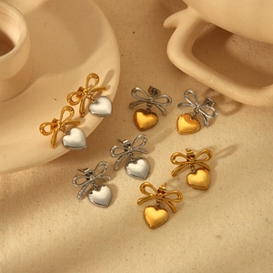 Polished stainless steel heart and bow earrings in gold and silver duo-tone finish