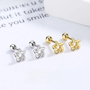 Star-shaped woven chain earrings in gold and silver finish with screw back closures
