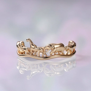 Detail of creative circus animal ring with gold elephant giraffe and lion figures