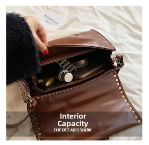 Macro view showing internal compartments and storage capacity of brown leather satchel
