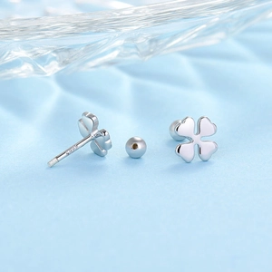 Macro view of silver S925 sterling silver four-leaf clover stud with screw back closure