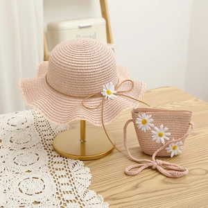 Pink straw sun hat and matching flower bag set for kids with daisy and bow details