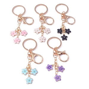 Set of five colorful enamel cherry blossom keychains with metal clasps in various colors