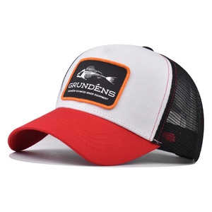 Detail of Grundéns trucker hat featuring fishbone embroidery and breathable black mesh