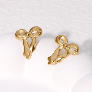 18K gold-plated stainless steel bow earrings with matte finish on a white base