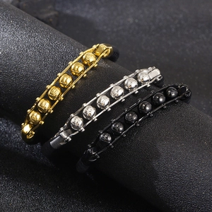 Three men's woven leather bracelets with gold, silver, and black engraved metal charms
