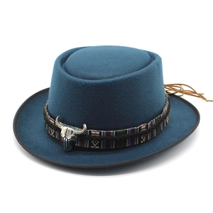Blue wool western pork pie hat with ethnic band, silver bull skull, and leather tassels