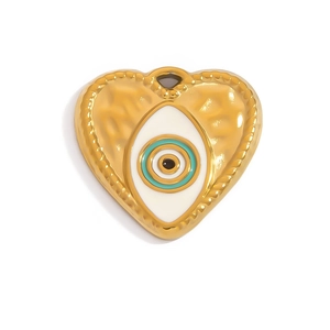 Detail of 18K gold heart pendant with evil eye pattern and hammered texture finish