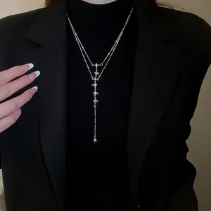 Double-layered stainless steel star tassel necklace with sparkling crystal accents