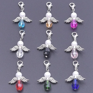 Detail of colorful crystal angel wing charms with lobster clasps for DIY jewelry making