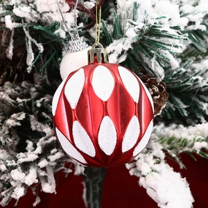 Close-up of a festive red and white glitter diamond pattern Christmas ball ornament