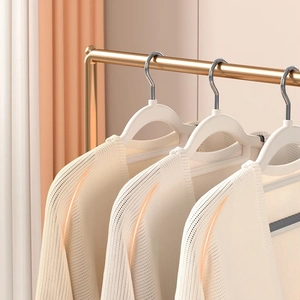 Non-slip white clothes hangers with shoulder-contoured design for anti-bump knitting wear