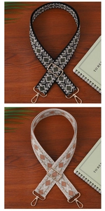 Detail view of ethnic style woven canvas bag straps with gold metal swivel snap hooks