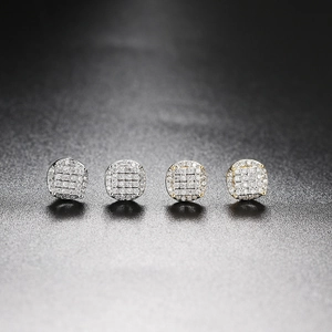 Detailed view of silver and gold plated hip hop stud earrings with full zircon stones