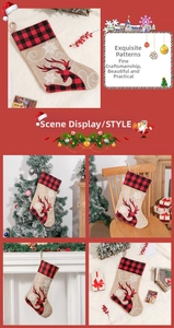 Detail of Christmas stocking with reindeer embroidery and red buffalo plaid cuff accents