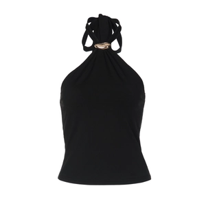Detail of black halter top featuring a polished gold buckle on the neckline fabric