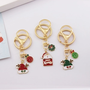 Three-piece gold metal Christmas keychains with Santa Claus and enamel holiday charms