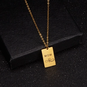 Gold stainless steel Mom necklace with infinity heart pendant on black jewelry box