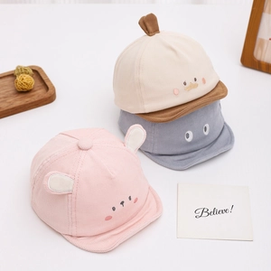 Cute corduroy baby hats with animal ears in pink, beige, and blue colors