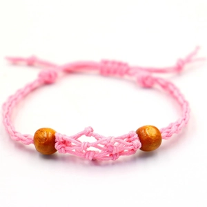 Handmade woven pink cord bracelet featuring wooden beads and an adjustable knot closure