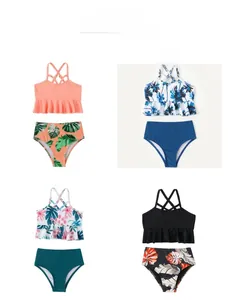 Front view display of four different patterns of girls' two-piece bikini swimsuit sets