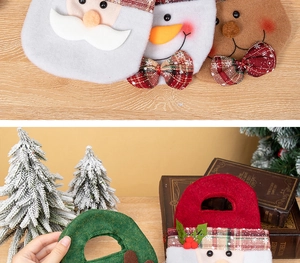Detail of Christmas felt gift bags featuring Santa, snowman, and reindeer embroidery