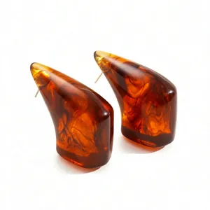 Minimalist geometric amber resin claw earrings with tortoise shell pattern in irregular shape