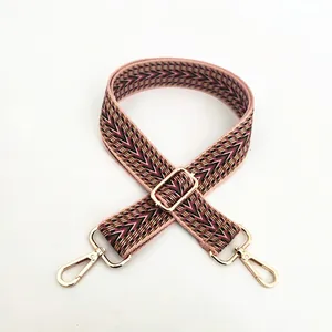 Close-up of ethnic style jacquard strap No.13 with golden metal hooks and buckles