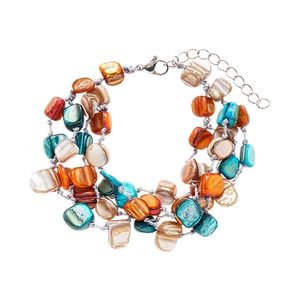Bohemian multilayer geometric beaded bracelet with turquoise and faux shell accents
