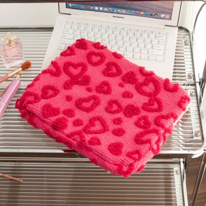 Detail of rose red plush laptop sleeve with embossed hearts for 13-14 inch MacBook