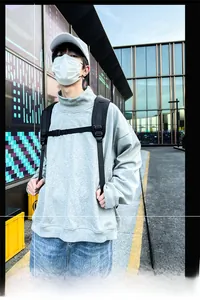 Detailed view of light gray high-neck oversized hoodie with ribbed cuffs and loose fit