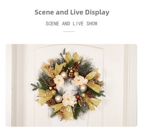 Detail of Christmas wreath with golden bow, pine cones, and cream flowers on a white door