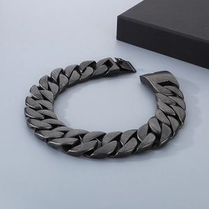 Close-up of a 31mm thick stainless steel Cuban link bracelet with a secure clasp buckle