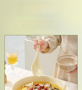 Close-up of lead-free underglaze ceramic soup spoon with a smooth cream finish