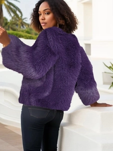 Detail of purple long-pile faux fur texture on a cropped jacket for autumn fashion