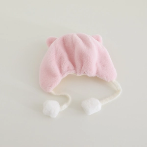 Detail view of pink baby winter hat with soft faux fur texture and cute 3D animal ears