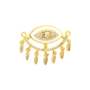 Macro shot of gold-plated evil eye pendant with white enamel and sparkling zircon accents