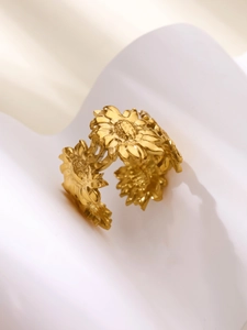 Detailed close-up of an 18k gold plated stainless steel hollow flower adjustable ring