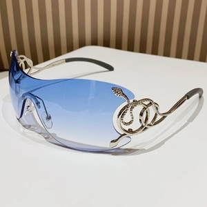 Y2K frameless sunglasses with blue gradient lenses and silver snake metal temple detail