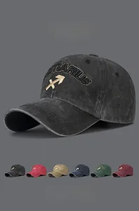 Detail of Sagittarius embroidery on washed cotton vintage baseball cap with six colors