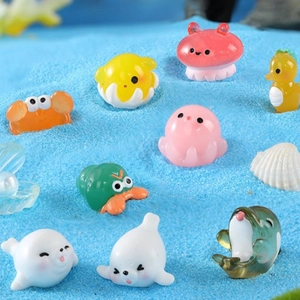 Miniature resin sea animal figurines set with colorful ocean creatures on blue sand