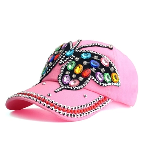 Detail of pink denim baseball cap with colorful crystal butterfly and rhinestone brim decoration