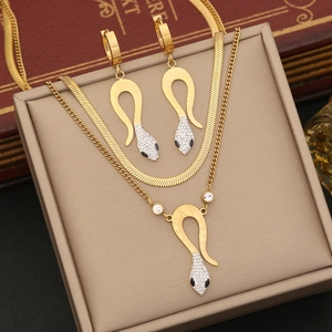 Golden double-layer snake necklace and earring set with crystals on beige display box
