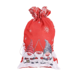 Christmas burlap gift bag with festive gnome print and drawstring closure for candy packaging