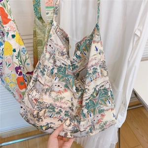 Detail of artistic canvas tote bag featuring traditional Chinese landscape painting print