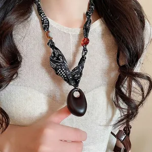 Ethnic bohemian necklace with fabric polka dot cord and oval wood pendant jewelry